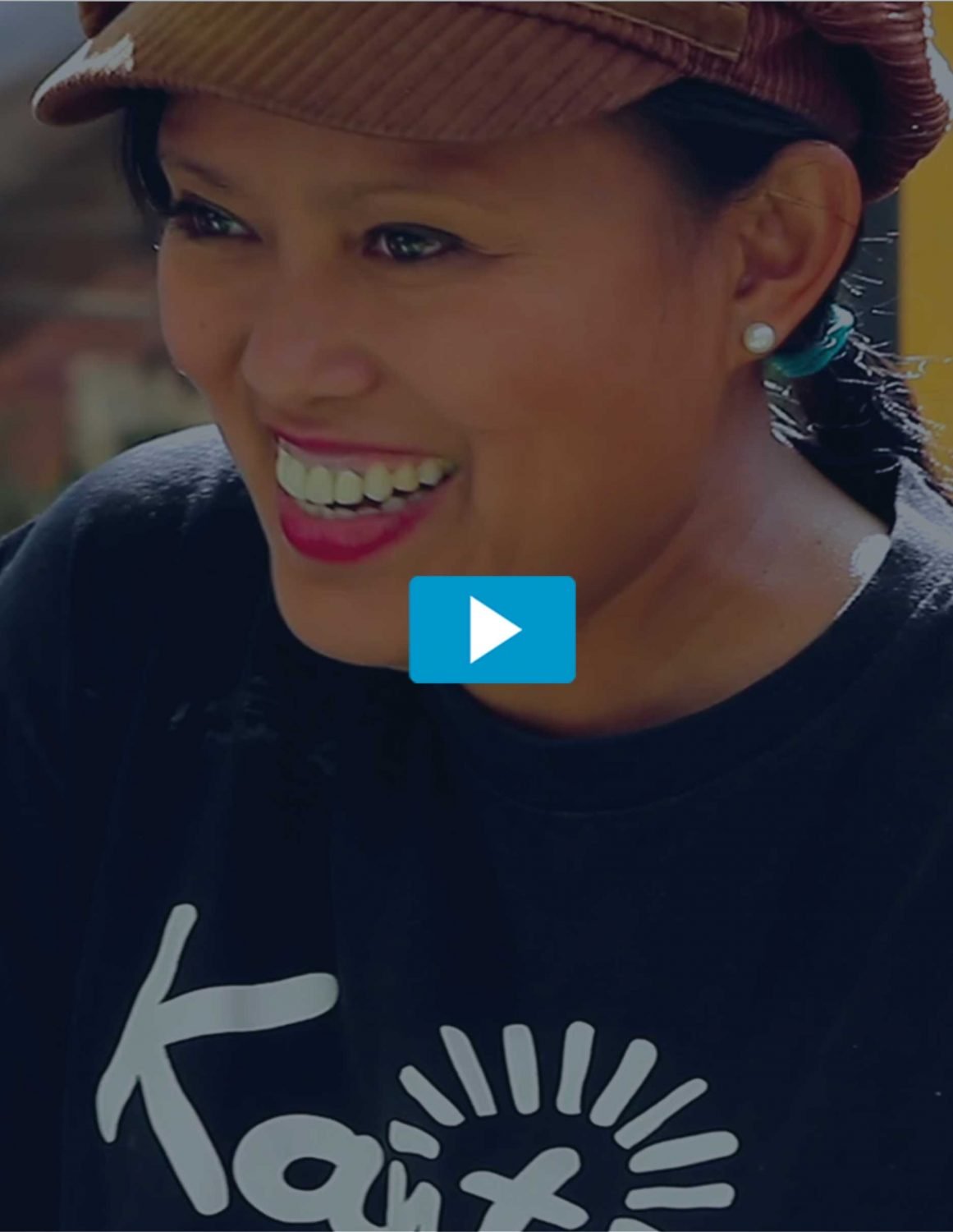 Smiling woman in Kanto shirt